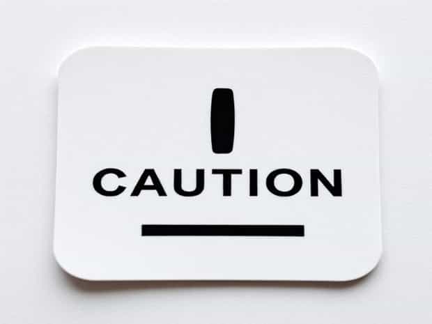 In Caution Crossword Clue